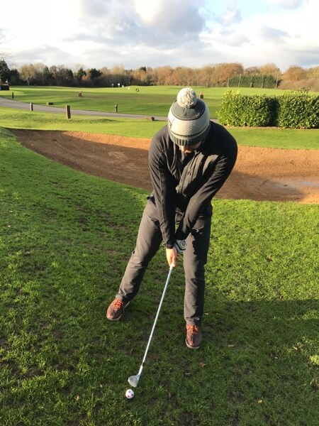 Downhill Lie pitch shot